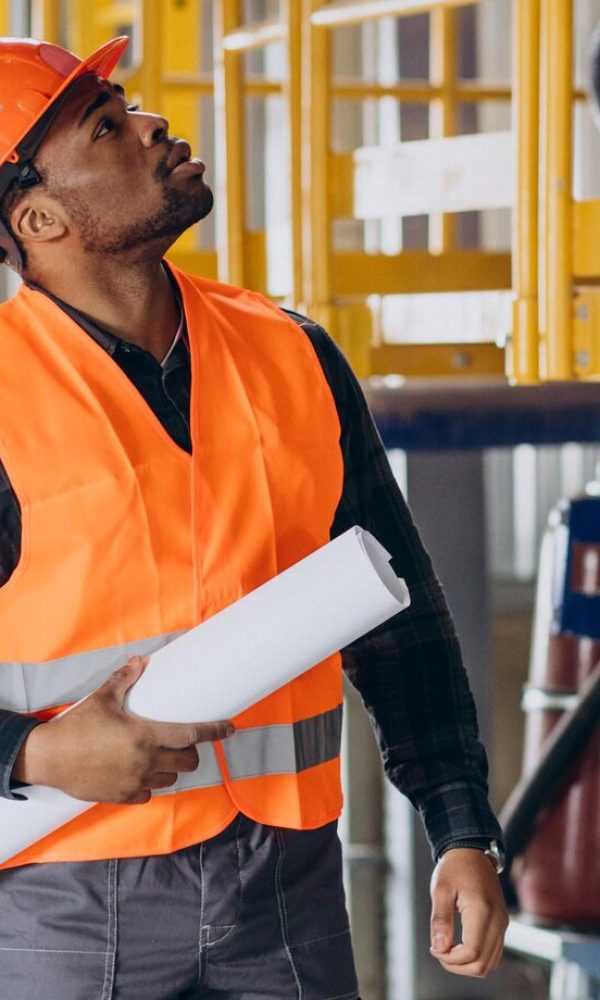 african-american-worker-standing-uniform-wearing-safety-hat-factory_1303-30606